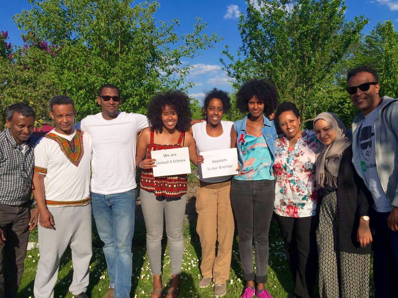 Gruppenfoto mit Schild One Day Seyoum